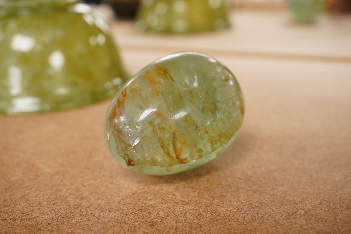 A Chinese bowenite jade bowl and a green quartz egg paperweight, 13cm